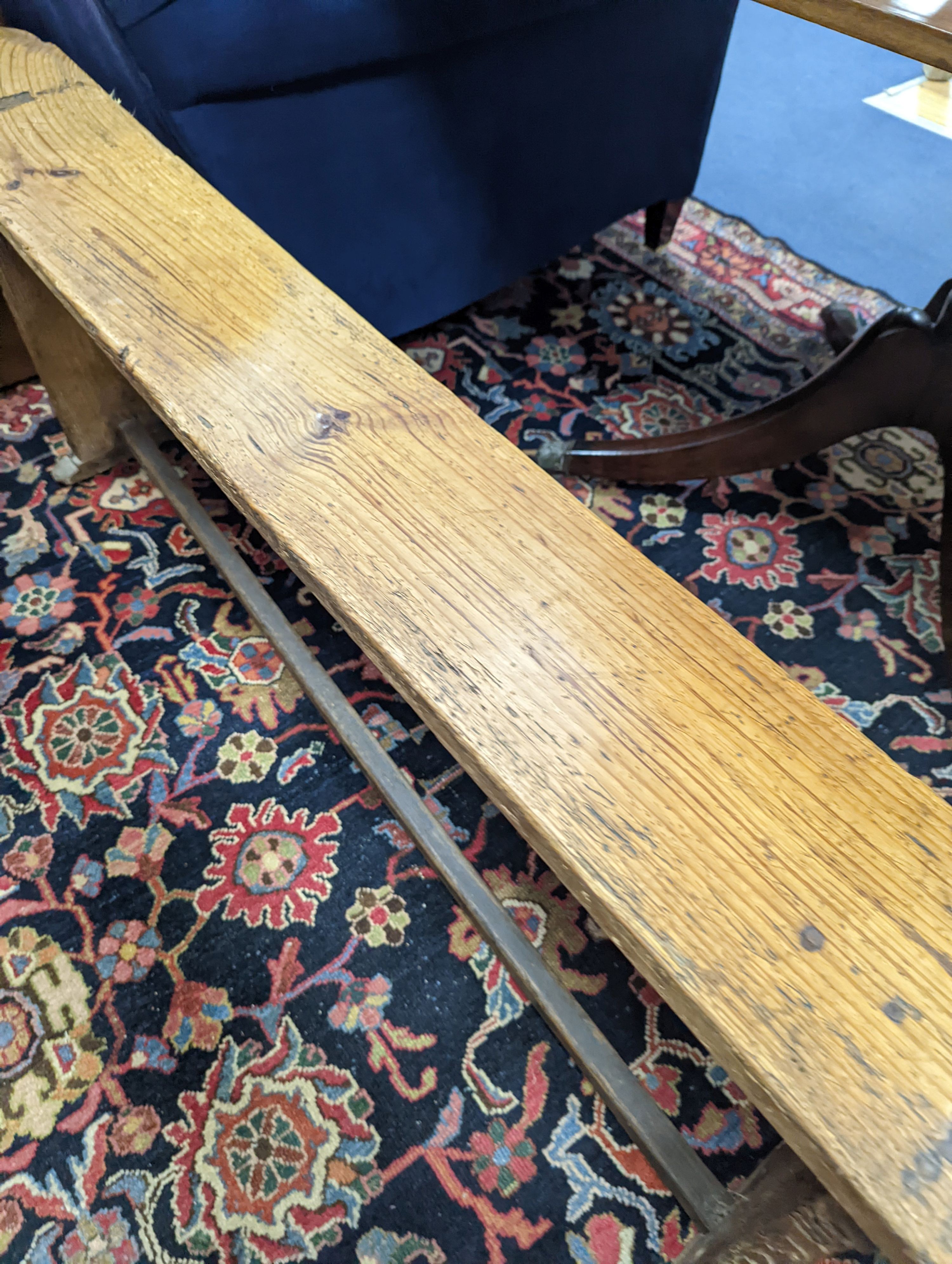 An 18th century pine bench, length 162cm, height 49cm